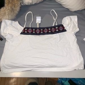 White off the shoulder crop top. Loose fitting.